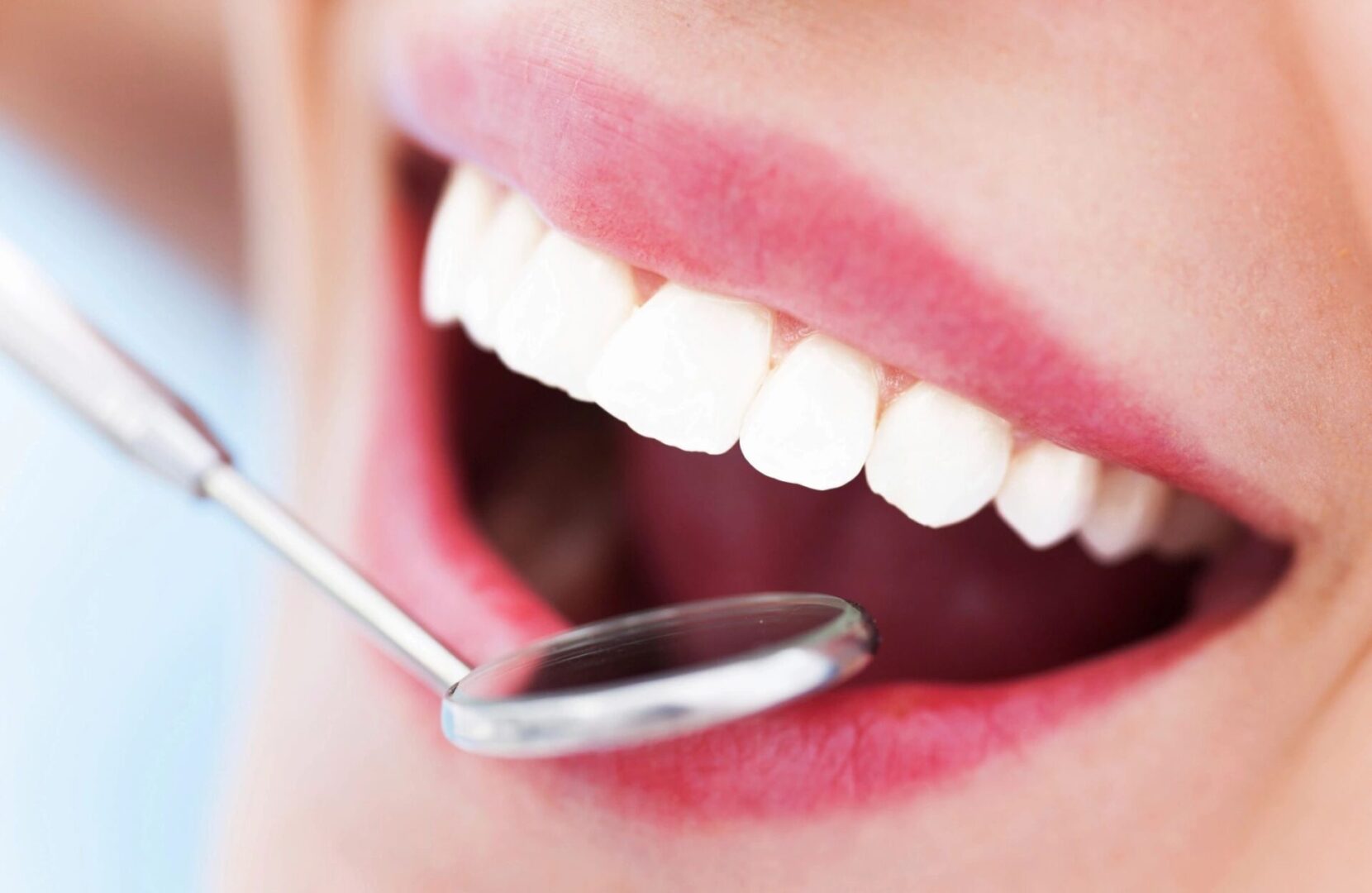 A close up of a person holding a spoon